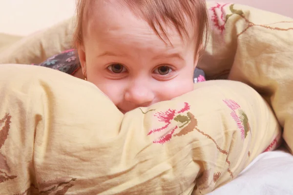 Bedtime  (young girl lying on the bed under the covers)