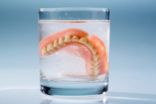 Denture in water glass