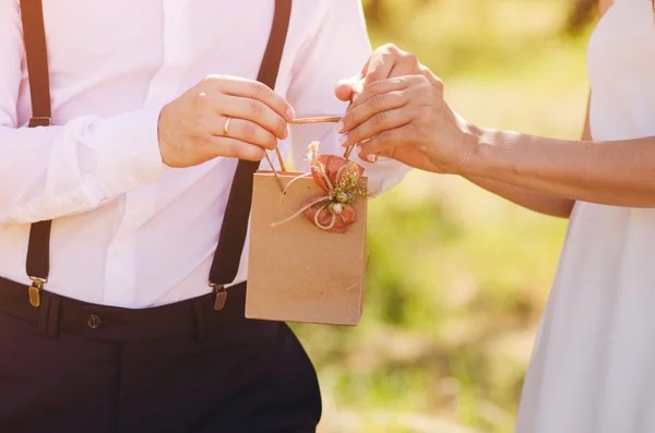 Man prepares a gift to his girlfriend