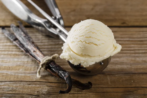 Ball of vanilla ice cream in a spoon scoop