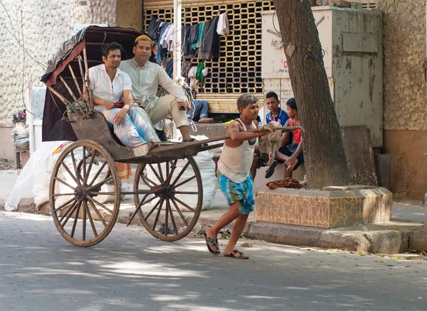 Traditional hand pulled rickshaw driver
