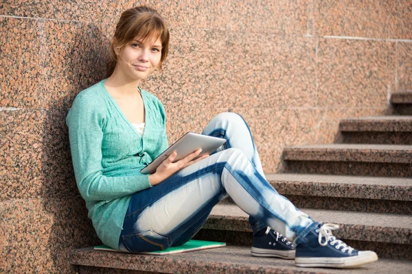 Beautiful young woman student with note pad. Outdoor student.