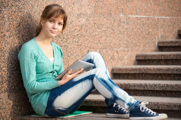 Beautiful young woman student with note pad. Outdoor student.