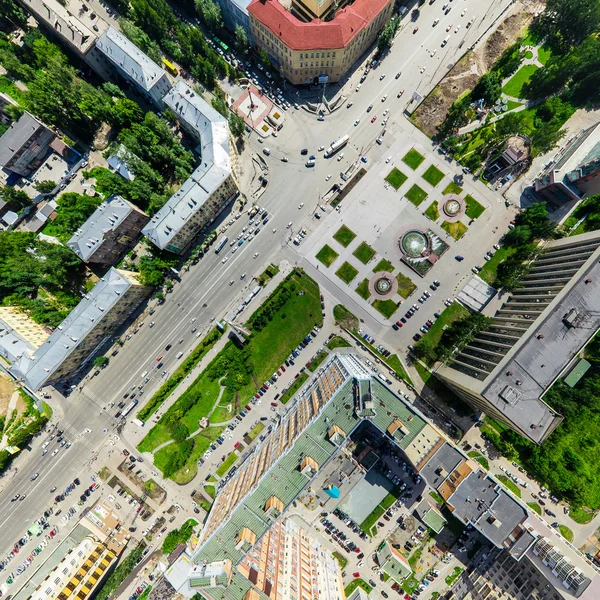 Aerial city view with crossroads and roads, houses buildings. Copter shot. Panoramic image.