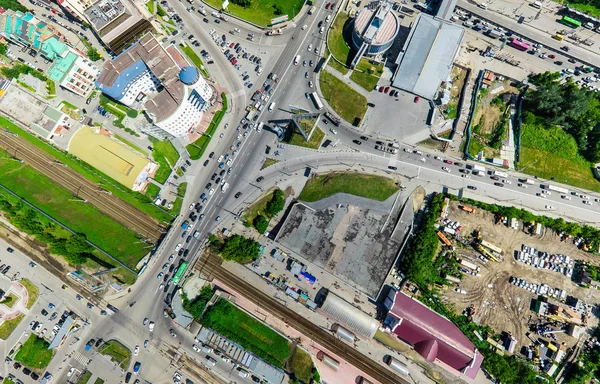 Aerial city view with crossroads and roads, houses buildings. Copter shot. Panoramic image.