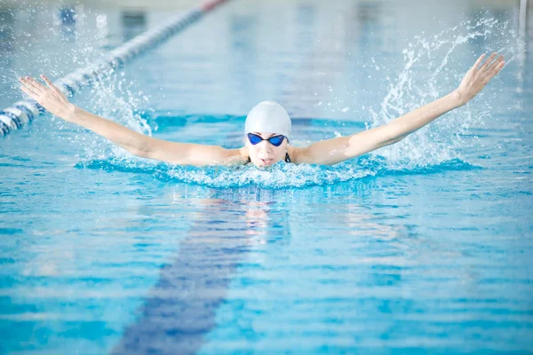 Girl swimming in butterfly stroke style