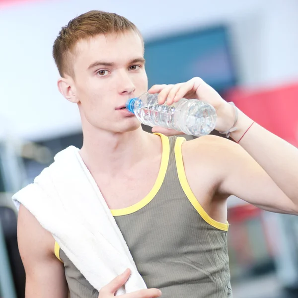 Man drinking water after sports