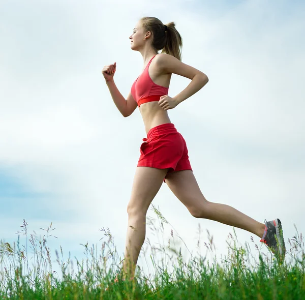 Young woman running summer park rural road. Outdoor exercises. J