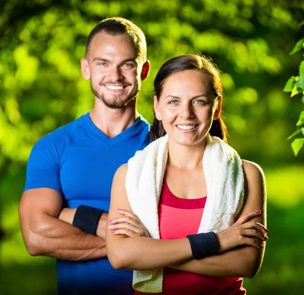 Athletic man and woman after fitness exercise