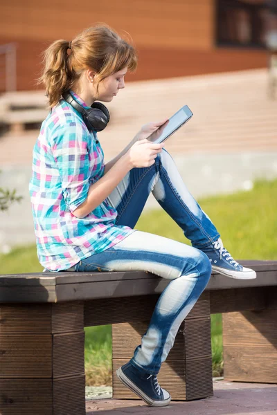 Beautiful young woman student with note pad. Outdoor student.