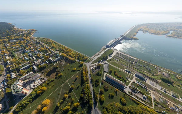 Aerial water power plant view with crossroads and roads, civil  buildings.