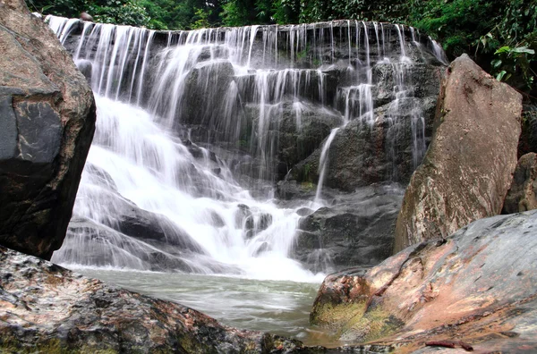 Waterfall in deep rain forest jungle. (Mae pool Waterfall in Uttaradit Province, Thailand)