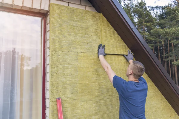 House insulation - insulating house facade with mineral rock woo