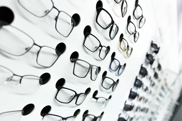 Optical store, wall of many fashionable eyeglasses