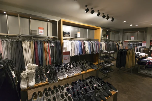 Interior of casual clothes and shoes shop