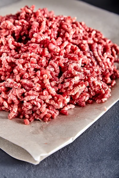 Raw ground beef on a craft paper