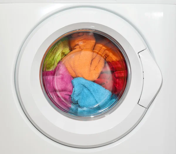 Wash machine with colored clothes inside