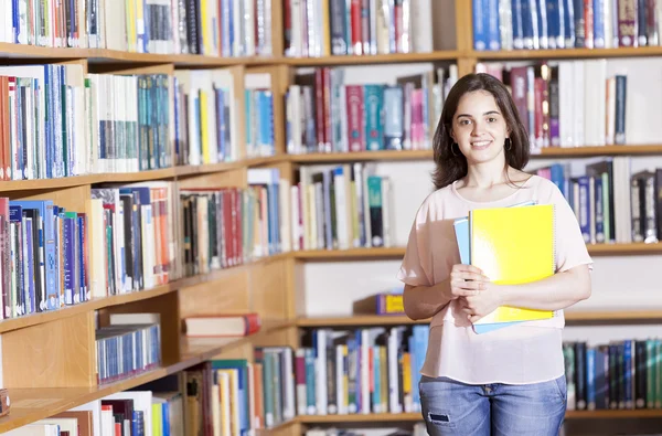 Female student holding books