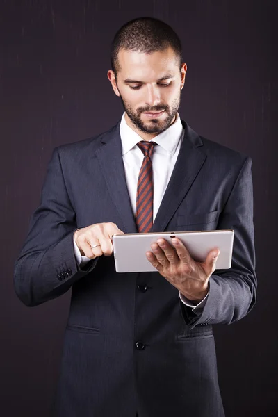 Executive man using a digital tablet