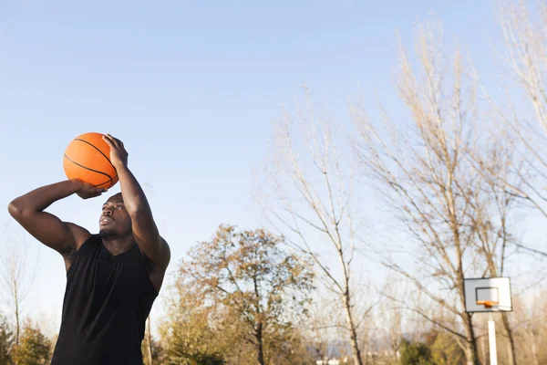 Street basket player playing outdoors