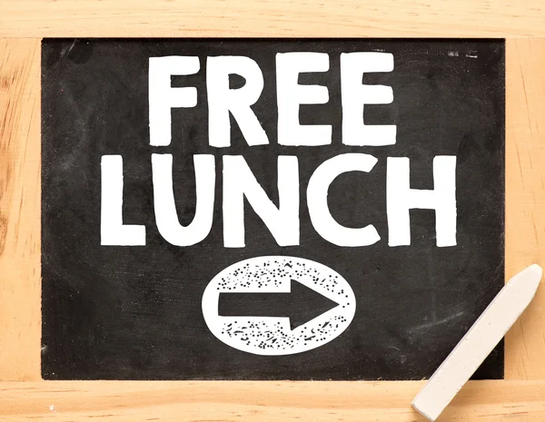 Free lunch text with arrow on blackboard