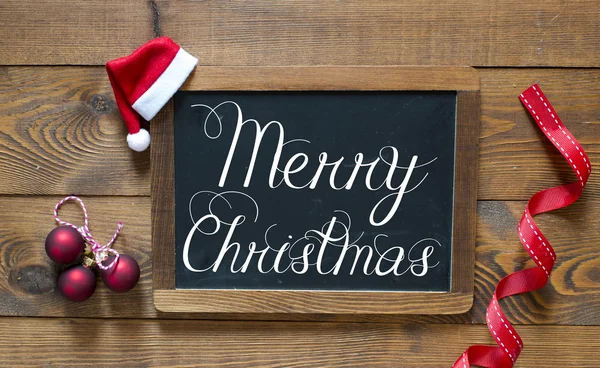 Merry Christmas inscription on chalk blackboard