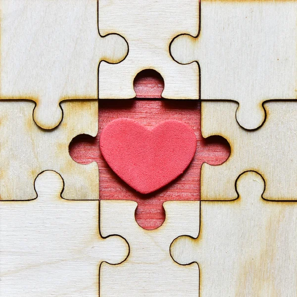 Jigsaw puzzle  with heart  background