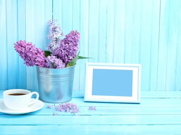 Photo frame wooden background morning alarm clock gentle blue tone lilac purple coffee