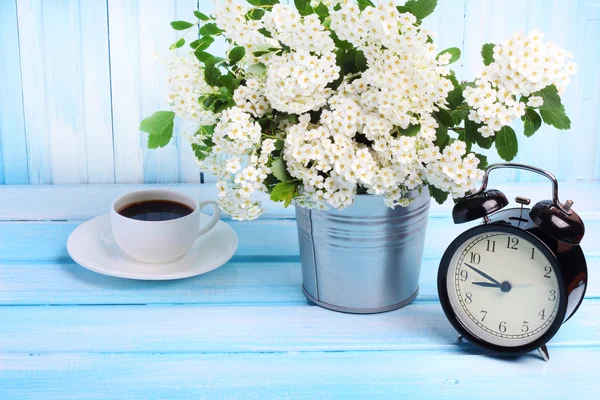 Flower garden wooden morning coffee time alarm clock background gentle blue tone