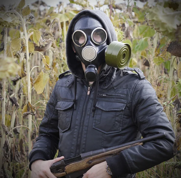 Man gas mask gun concept the danger of war