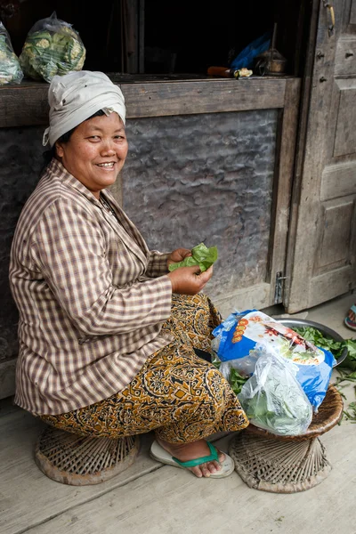 Local Woman Preparing Vegetables in Myanmar