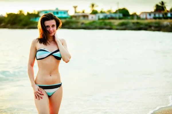 Skinny Russian girl posing on the beach paradise