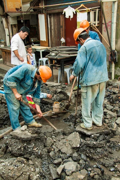 Street workers in the old center of Shanghai, China