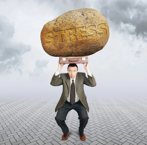 Businessman under the burden of stress. Difficulties in business