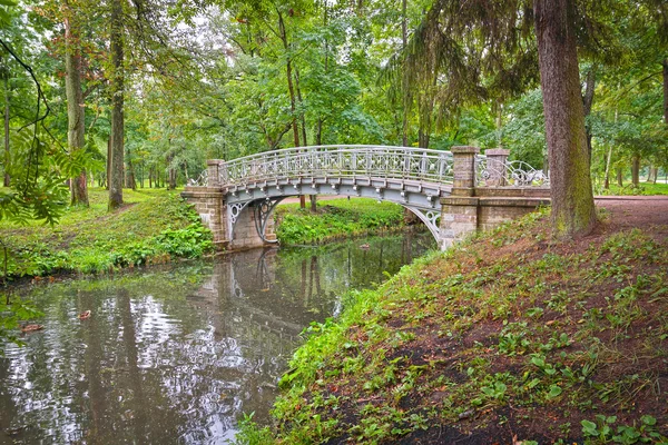 Ancient bridge over flow in the palace park