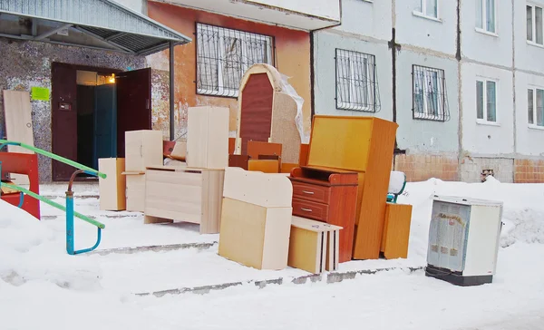 Flat moving. Furniture stands near the entrance of the house