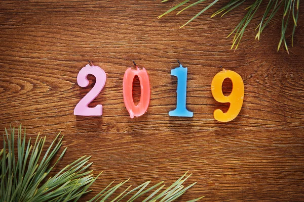 Wooden brown background about Happy New Year holiday 2019