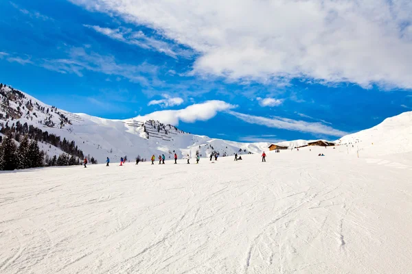 Ski resort in the Alps, people skiing