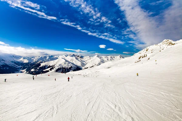 Ski resort in the Alps, people skiing