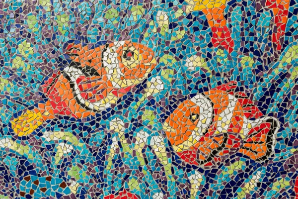 Colorful glass mosaic art shape fish and abstract wall backgroun