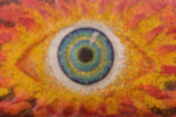 Colorful glass mosaic art shape eyes of god, blurred for backgro