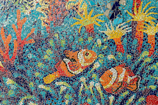 Colorful glass mosaic art shape fish and abstract wall backgroun