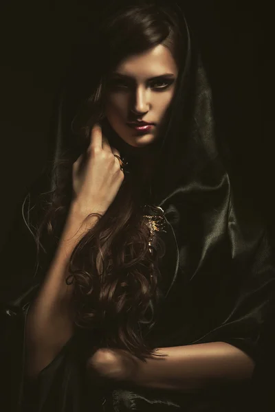Woman in black cape