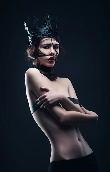Naked woman in black crown