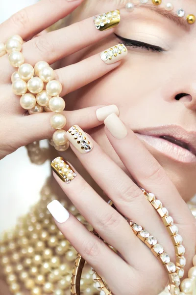 Pearl manicure with rhinestones.