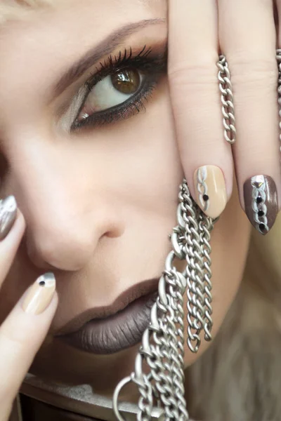Makeup and manicure brown chain.