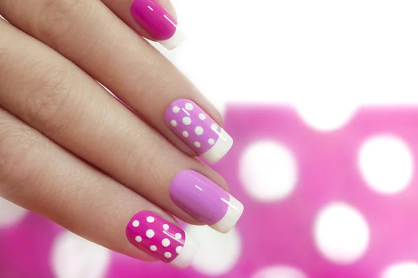 Nail design with white dots.
