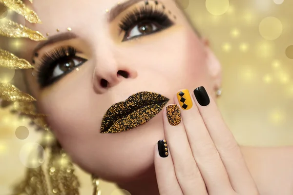 Caviar manicure and lips.