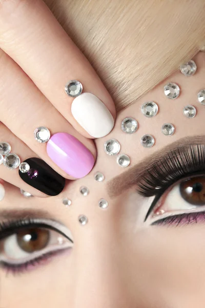 Manicure with rhinestones.