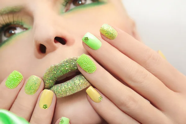 Green yellow manicure .